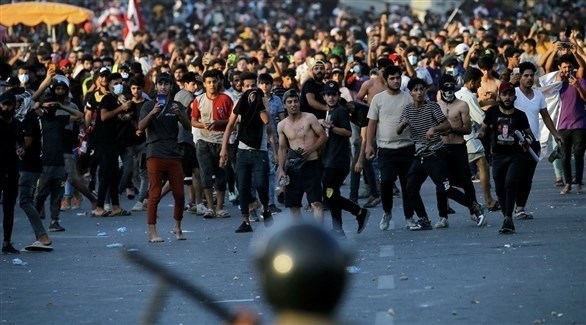 متظاهرون عراقيون يغلقون جسوراً ومبان حكومية في الناصرية